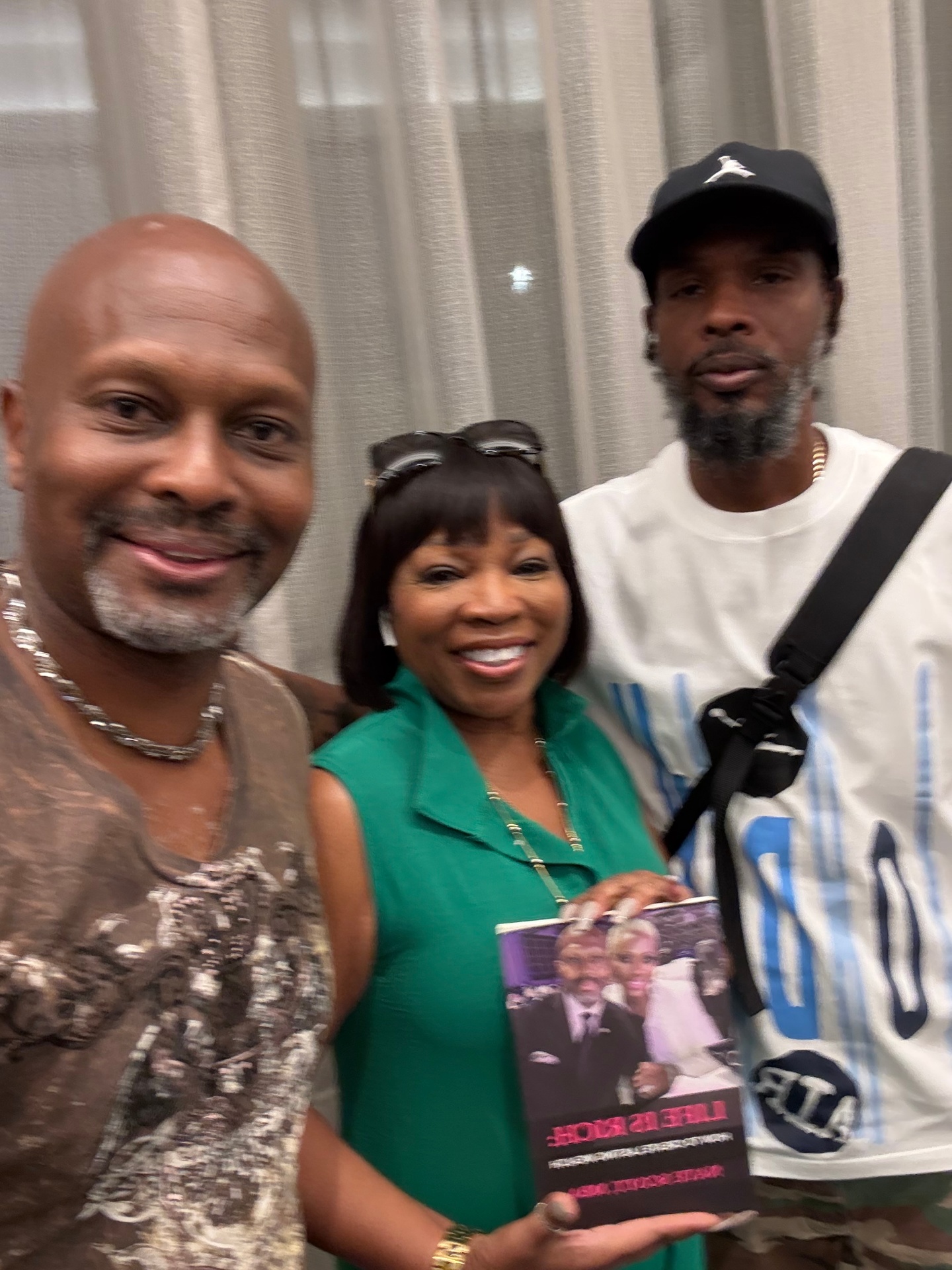Readers with Nate Scott holding Life Is Rich