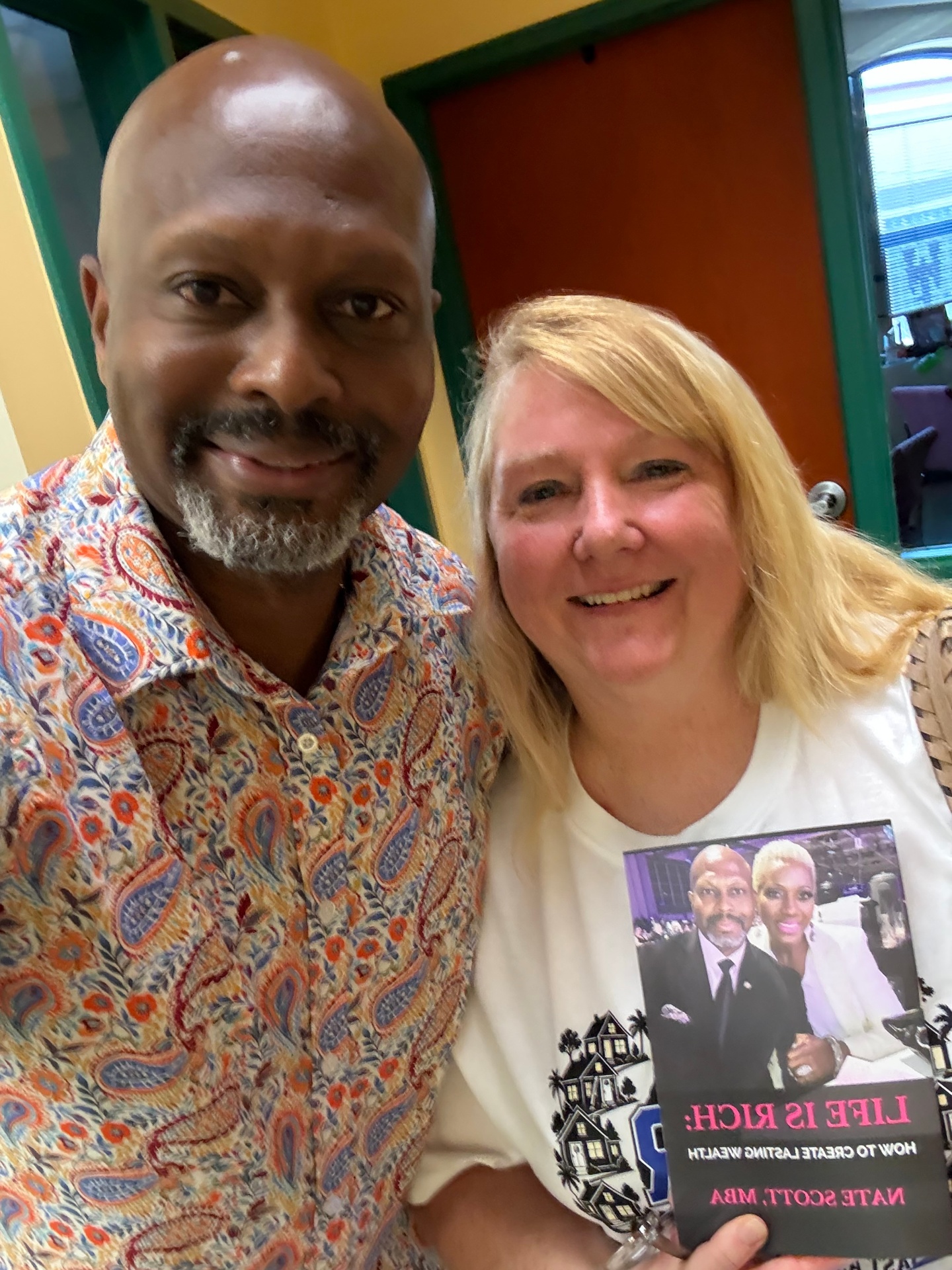 Reader with Nate Scott holding Life Is Rich