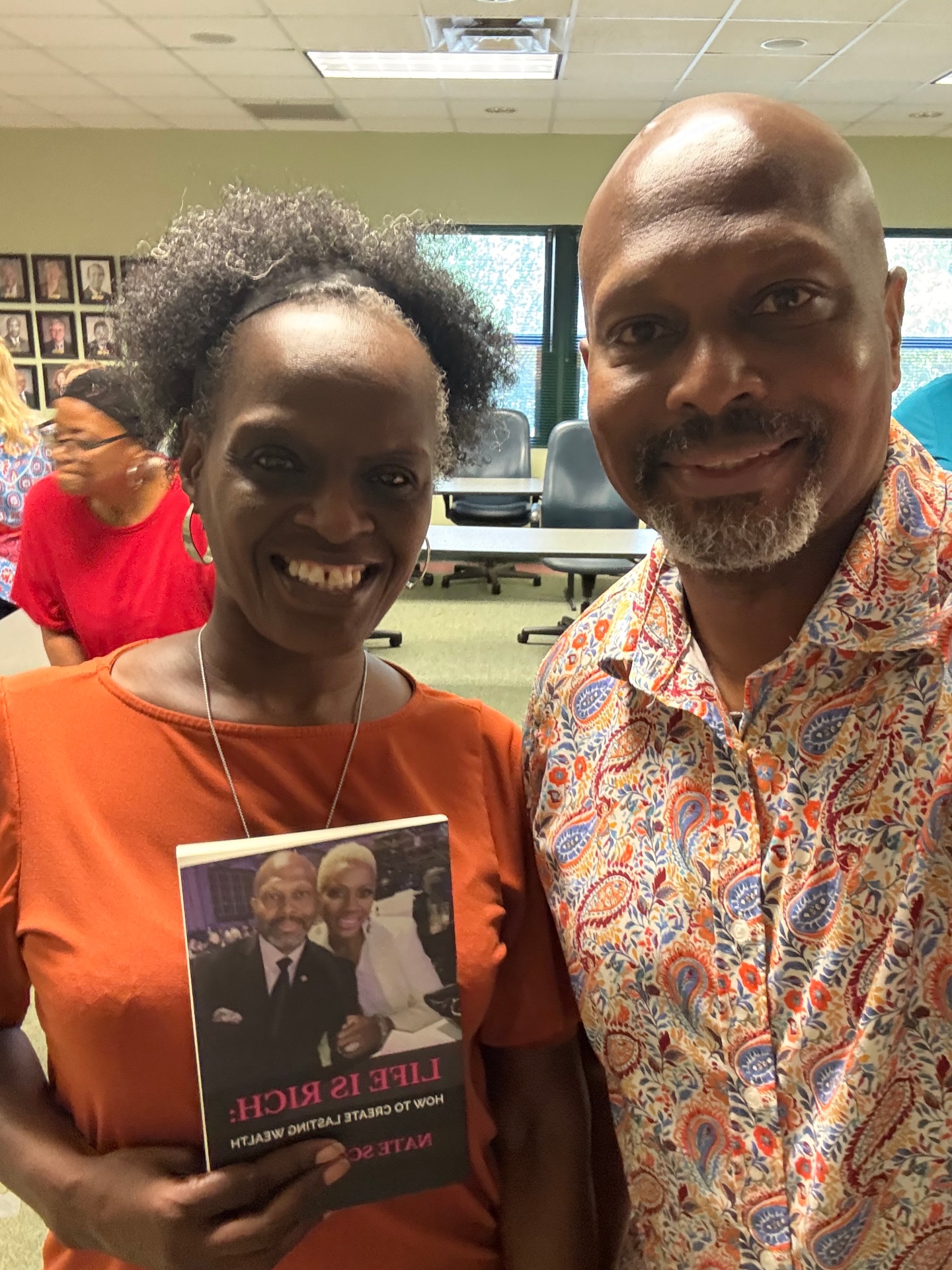 Reader with Nate Scott holding Life Is Rich